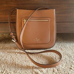Kate Spade leather cross body messenger. H-9.5” L9.5” W-2” Very gently used.